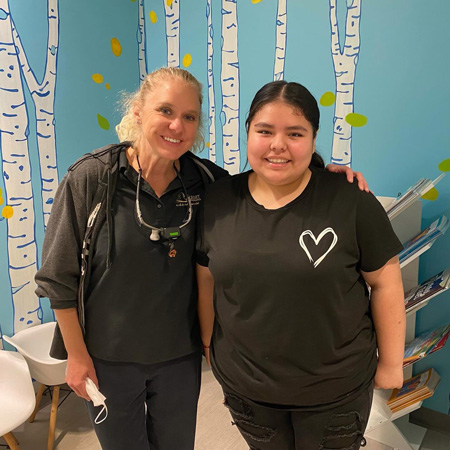 Dr. Wiggins with a patient at the Colorado Orthodontic Foundation clinic