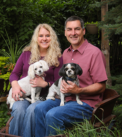 Dr. Wiggins with husband and dogs