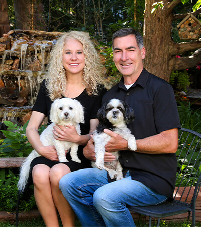 Dr. Wiggins with husband and dogs